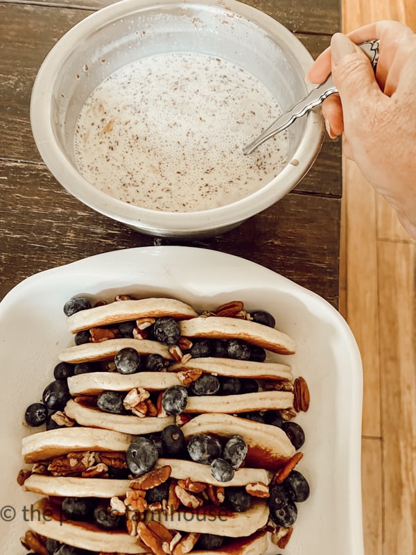 Mixture to pour over pancakes, blueberries and pecans.