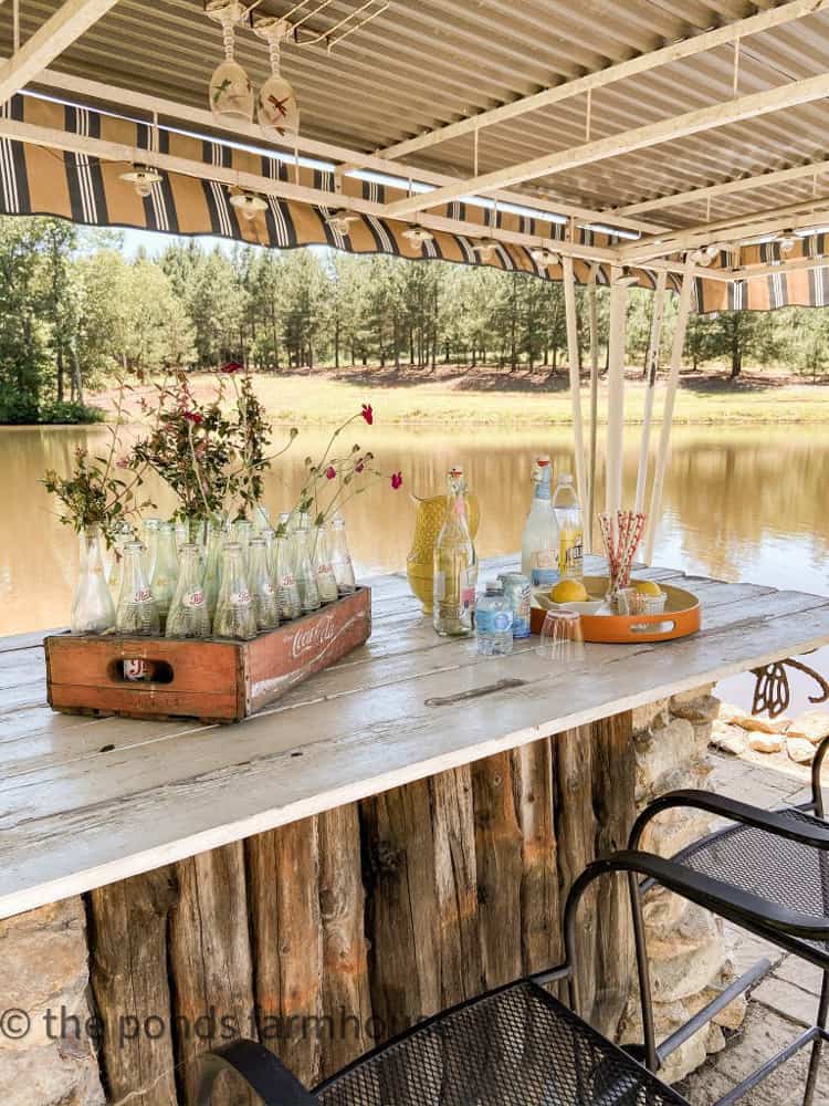 Outdoor kitchen bar with wooden top.  