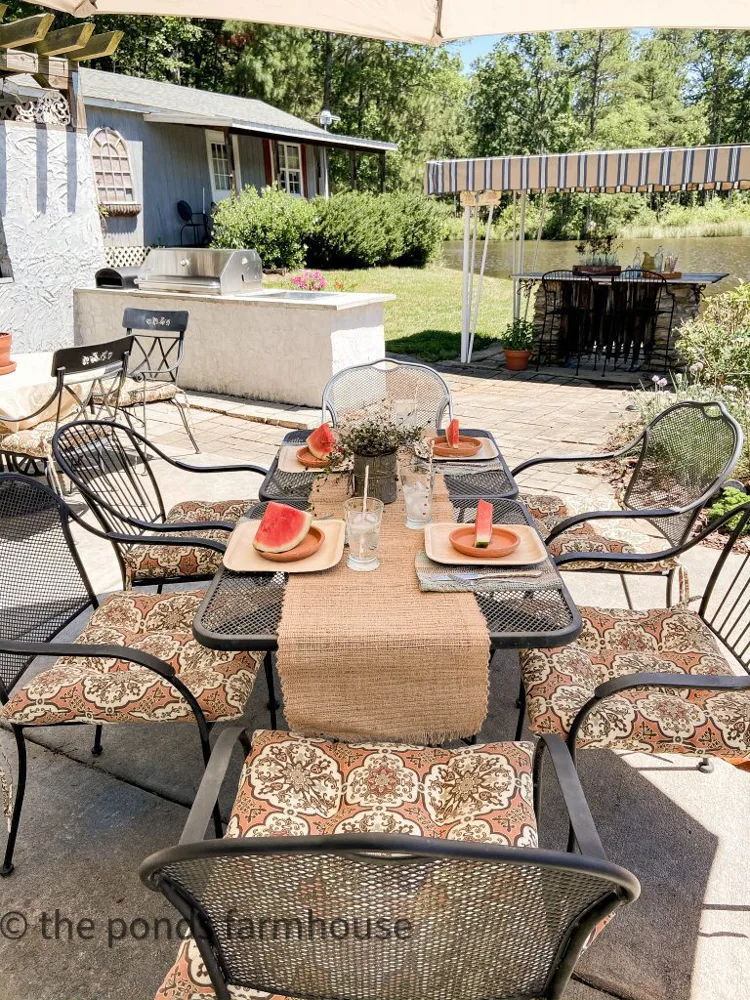 Dining table for outdoor alfresco dining at outdoor kitchen and entertainment area.