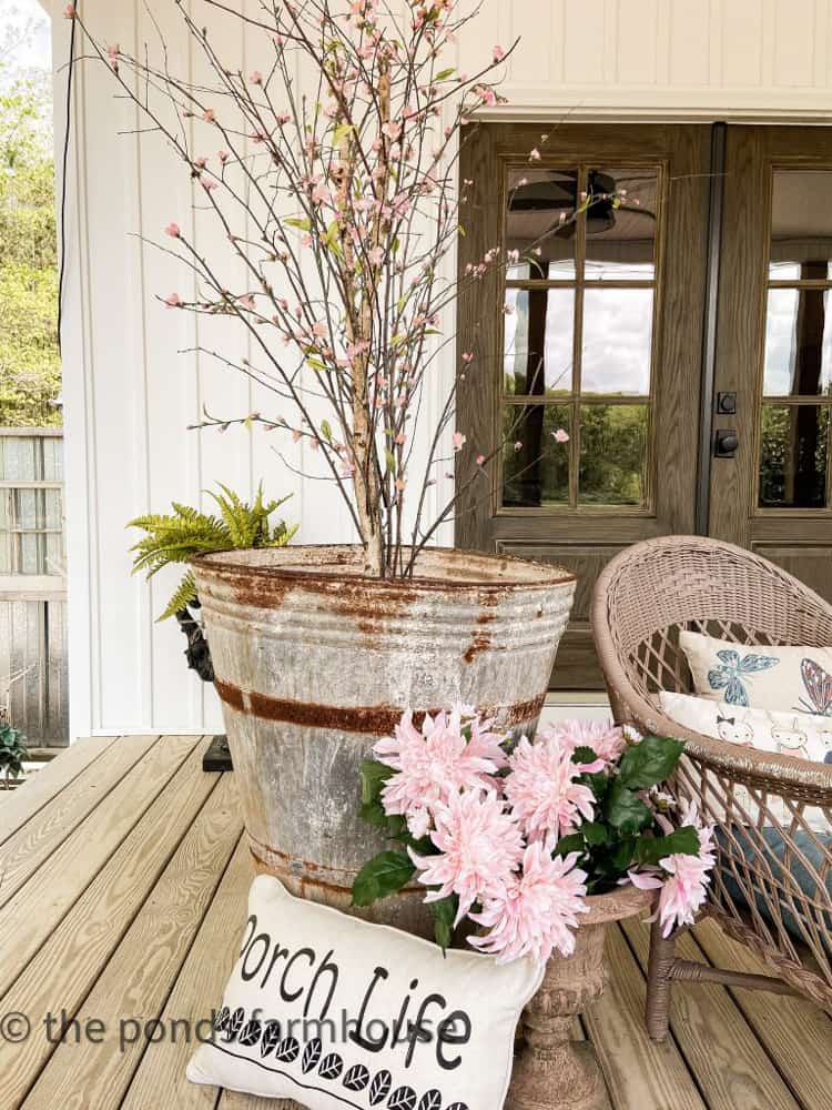 Recycle a ficus tree by replacing the leaves with cherry blossom stems.  