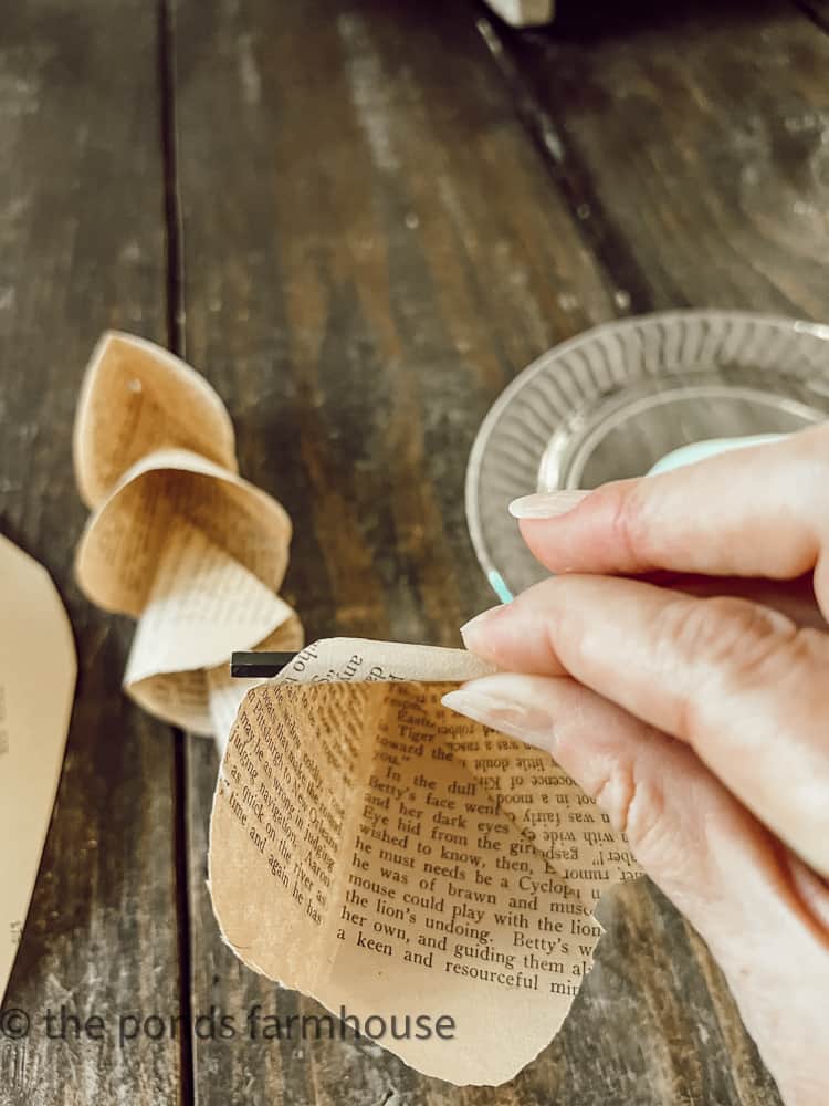 Roll the paper petals outward to look like a rose