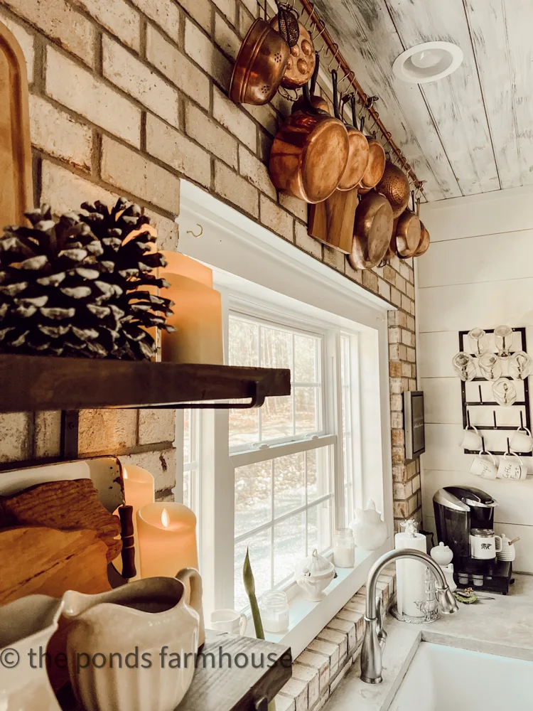 Farmhouse Winter Decorating with copper pots and open shelving for a farmhouse kitchen.