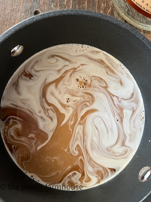 Hot White Russian mixed in sauce pan and heated before serving.