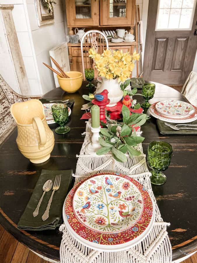 Traditional colors for a Valentine's Day Decor Tablescape. Bird Dishes and macrame table runner.