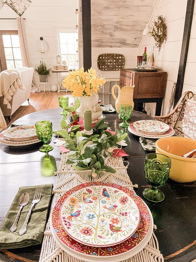 Traditional colors for a Valentine's Day Decor Tablescape.  Red and White bird dishes and green vintage water goblets