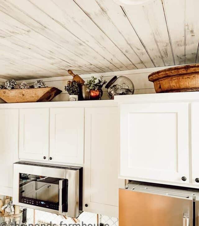 cropped-wooden-bowls-above-kitchen-cabinets-1.jpg