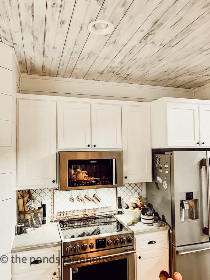 Should you decorate above your kitchen cabinets or leave them bare.
