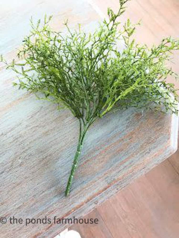 Faux rosemary fern to make topiaries.