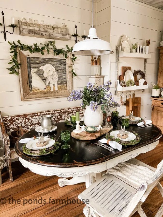 Easter or Spring Tablescape with DIY plate rack on wall behind the farmhouse table.  