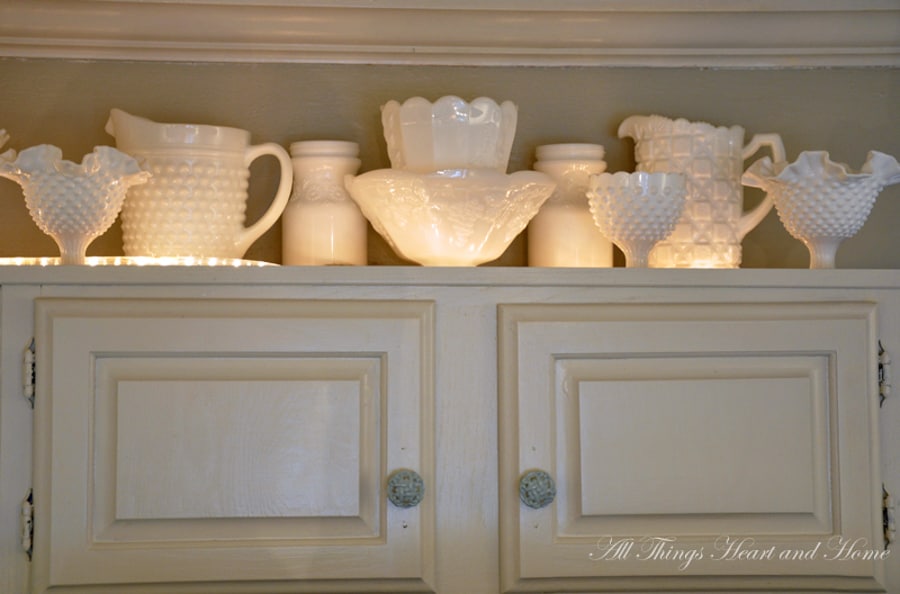 Collected milk glass above kitchen cabients
