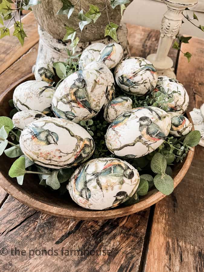 Bowl filled with napkin decoupage eggs with blue birds.  Easter Craft Ideas.