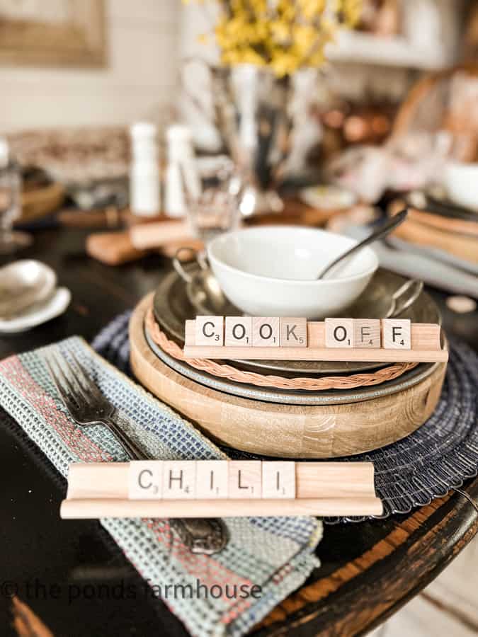 Chili Cook-off Table Setting with rustic wooden chargers and tin pan plates.