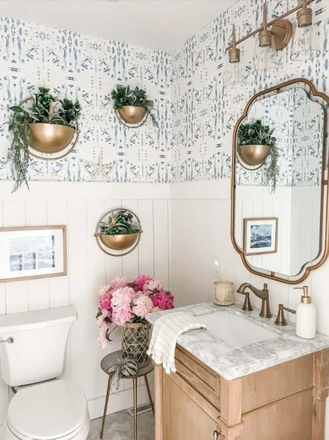 Heather's Bathroom Remodel with blue and white wall paper and vertical tongue and groove paneling.  
