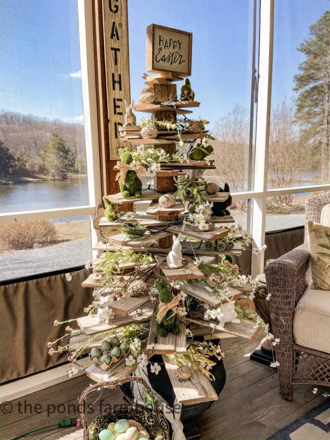 Shiplap Tree decorated for Easter with Birds and Bunnies. Florals fill the branches on the screened porch