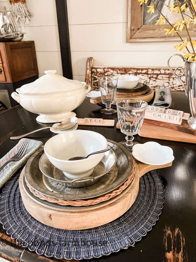 Chili Cook-off Table Setting with wooden chargers, vintage tin pans and thrift store finds.  