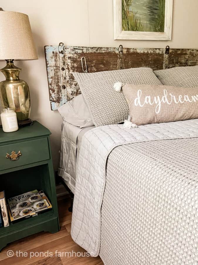 Unique Yard Sale Shutter repurposed for a space-saving headboard.  DIY Headboard