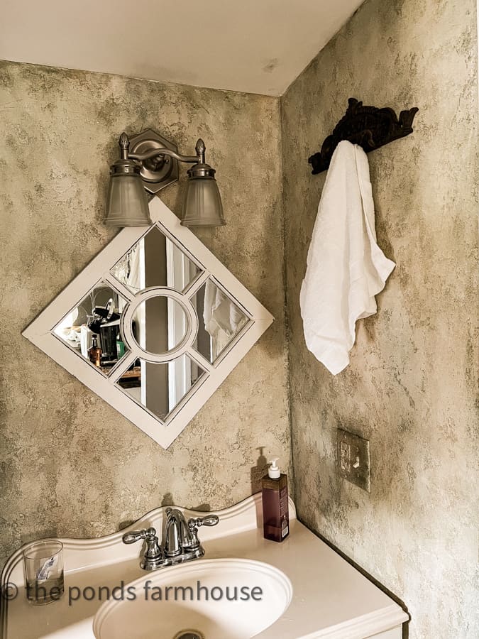 Before of bathroom remodel.  Textured wall faux finish which is out of date.  