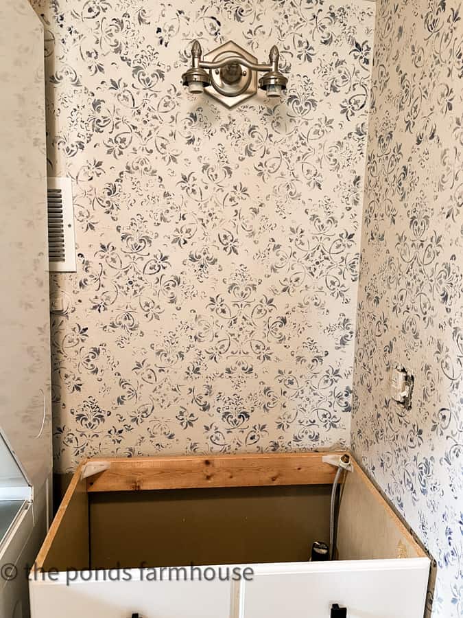 Faux Wallpaper using a wall stencil at tiny beach cottage bathroom remodel.  Part of Dirt Road Adventures.