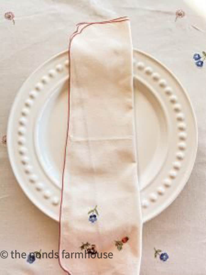 Thrifted napkins and tablecloth for a Valentine's Day or galentine's Day dinner table. 