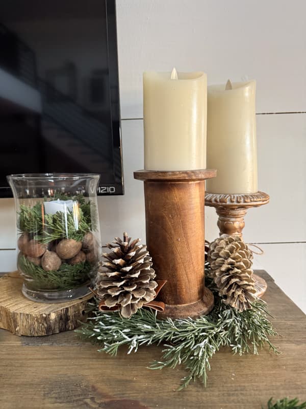 Wooden thread spool repurposed as a pillar candleholder