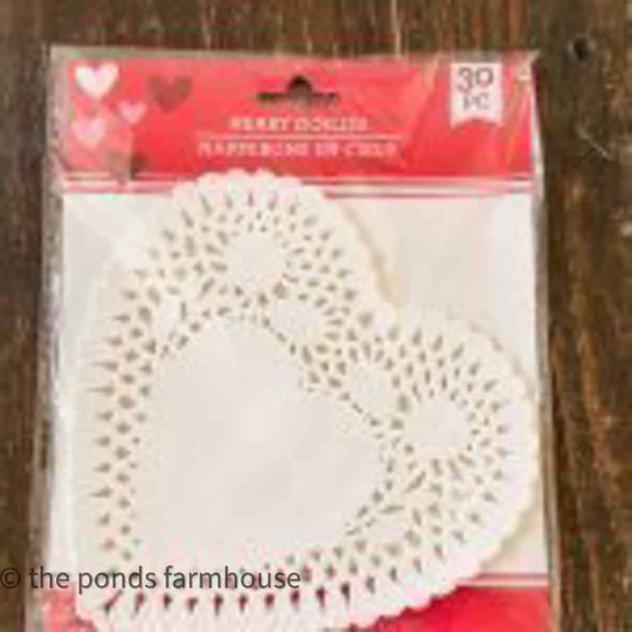 Dollar Tree heart doilies to make chair charms.  