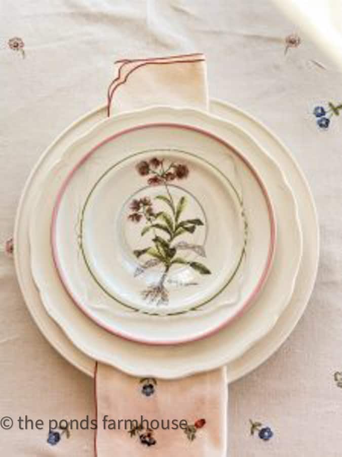 Vintage and thrift store tableware for a creative Galentine's Brunch table.