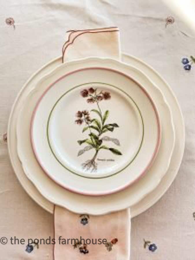 Vintage dishes and second-hand tablecloth for a Galentines Tablescape