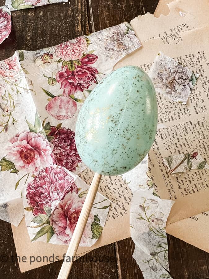For plastic eggs use skews, ice pick or chopsticks to hold the egg while applying the napkin decoupage