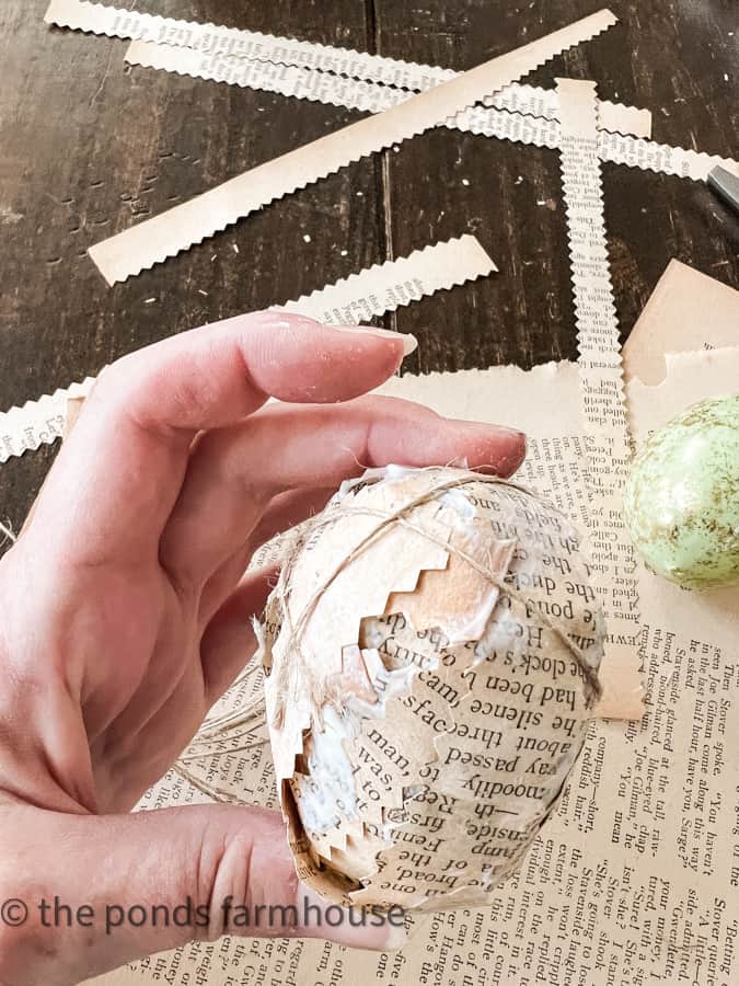 Add jute twine to hold paper on egg.