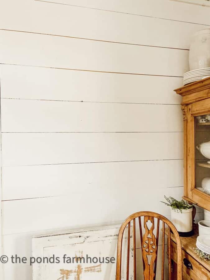 Blank shiplap wall to add a DIY WAll Plate Rack for added storage and Farmhouse Style Decorating.