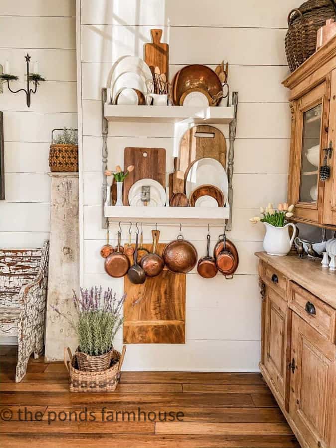 Vintage Collectibles fill the DIY Wall Plate Rack including antique copper pots and ironstone platters.  Country Chic Decor.