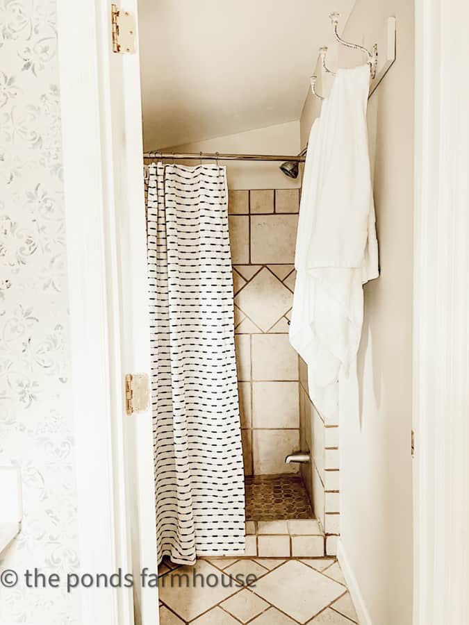 Small Bathroom remodel ideas in the beach. cottage remodel for the bathroom with a vintage shower curtain.