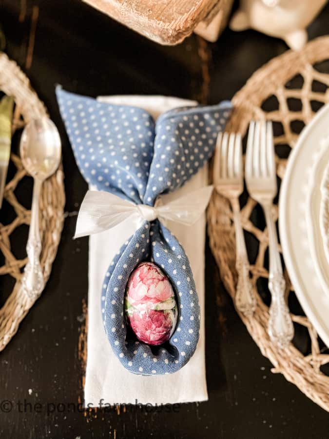 DIY Bunny Ear Folded Napkin in blue and white poka dot with decoupage eggs for Table Easter Decorations.