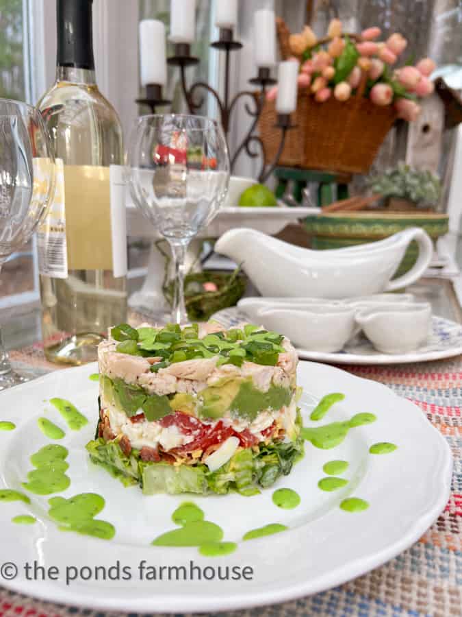 Stacked Salad on white plate served on Spring Fling Salad Bar for Supper Club in the Greenhouse/She Shed