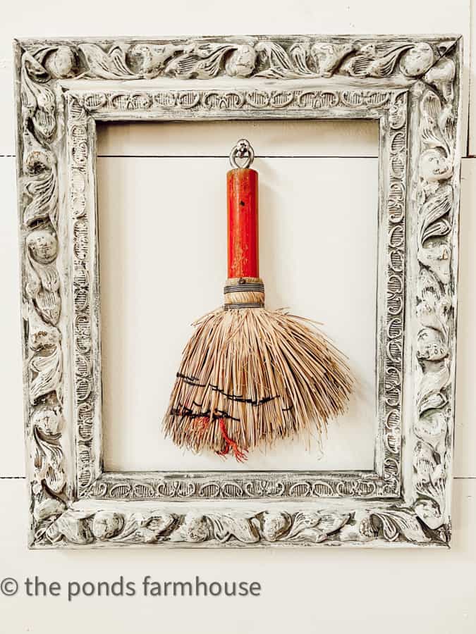 Add collectibles like vintage whisk brooms to old picture frames to create wall art.  