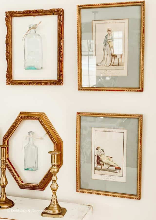 Use old art frames around vintage medicine bottles for a unique gallery wall.