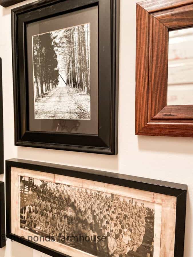 use mirrors and different shaped vintage frames to add character to a wall of images.  