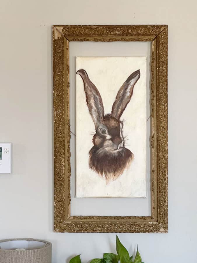 Frame around a canvas bunny with an recycled antique picture frame for a unique decorating idea.
