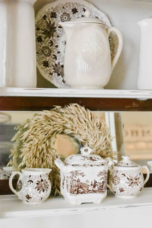 How to style a kitchen hutch with vintage dishes and transferware.