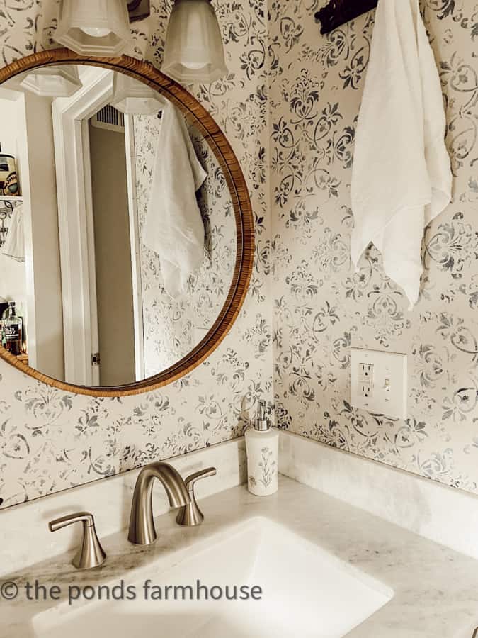 Change out the vanity cabinet Top with new faucet for budget friendly bathroom remodel ideas. wall stencil & new mirror