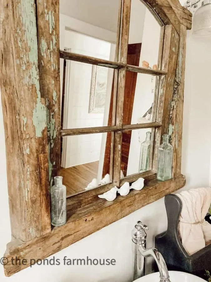 Antique Mirror made from an old window over the bathroom vanity.
