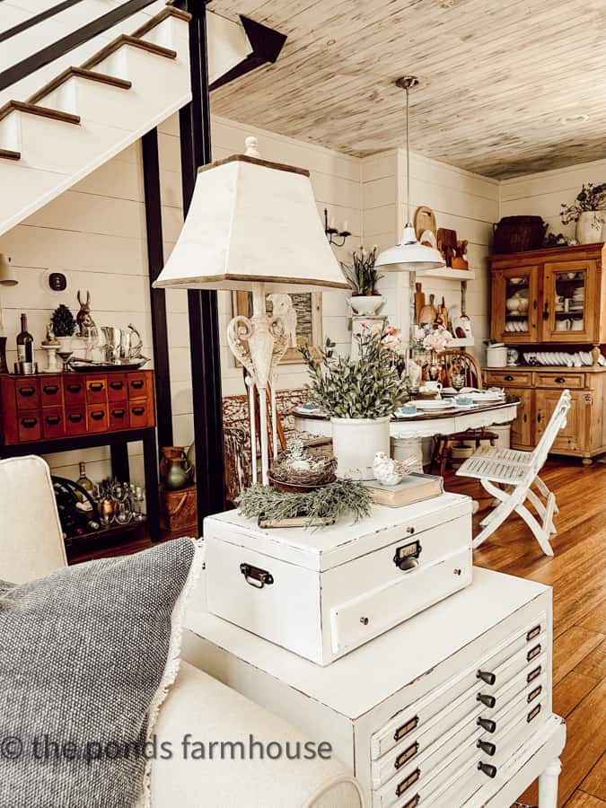 Side table repurposed with industrial feel and view of dining area 