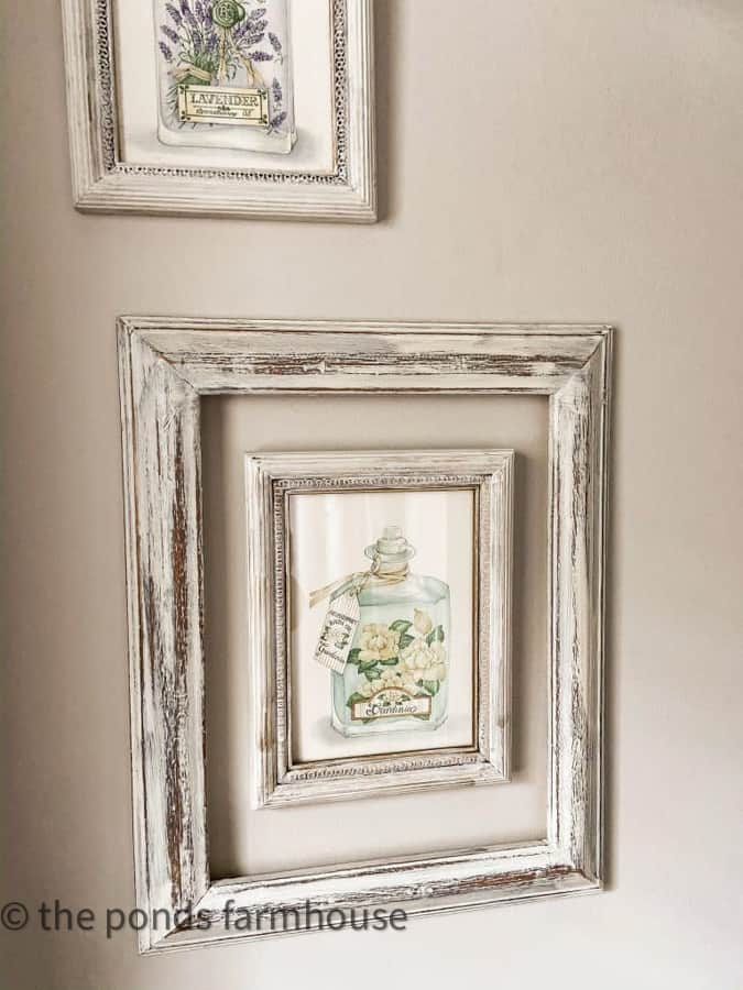 Vintage Perfume Bottle Prints surrounded by thrift store re-cycled picture frames.