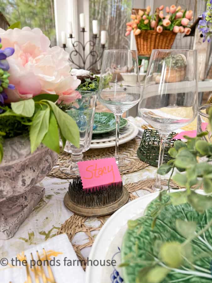 Supper Club Diner Party with vintage flower frogs with place cards and thrifted wine glasses 