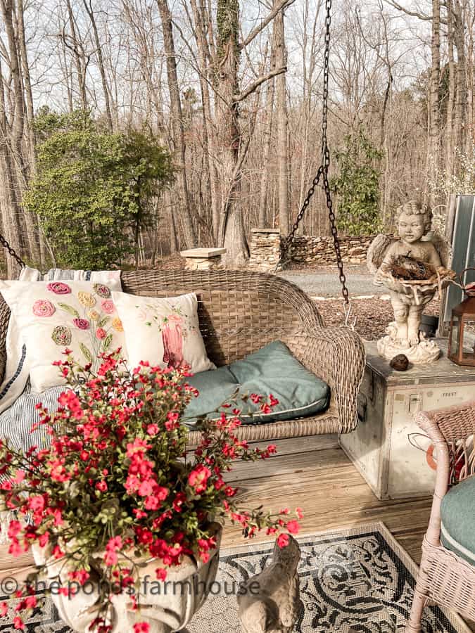 DIY Scrap fabric flower pillow, concrete angel and pink flowers to decorate the front porch for Easter