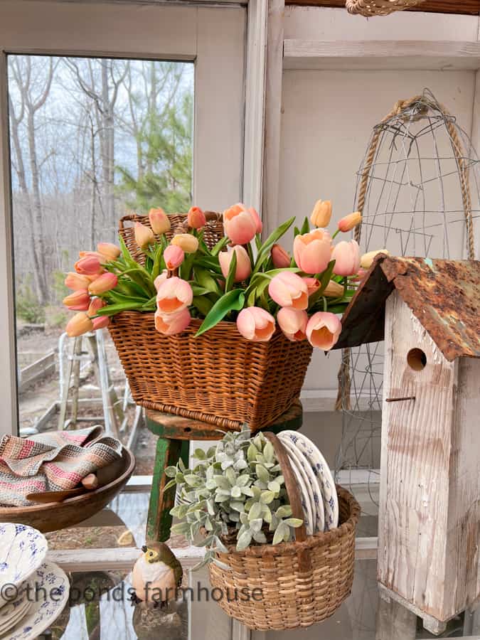 Tulips fill a vintage basket on the Spring Fling Salad Bar Table.  Ideas for setting up a salad bar party