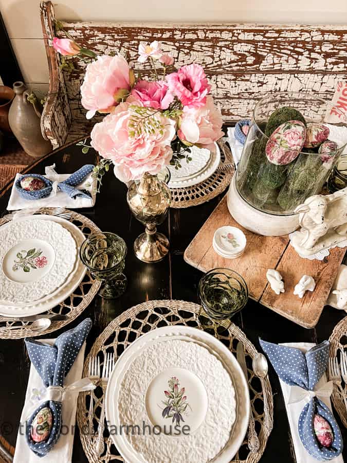 Affordable Decorated Easter Table Centerpiece with brass vases, wooden cheese board, and thrift store dishes.   