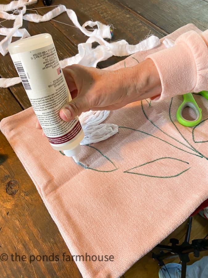 Use permanent fabric glue to attach fabric to the pillow cover.