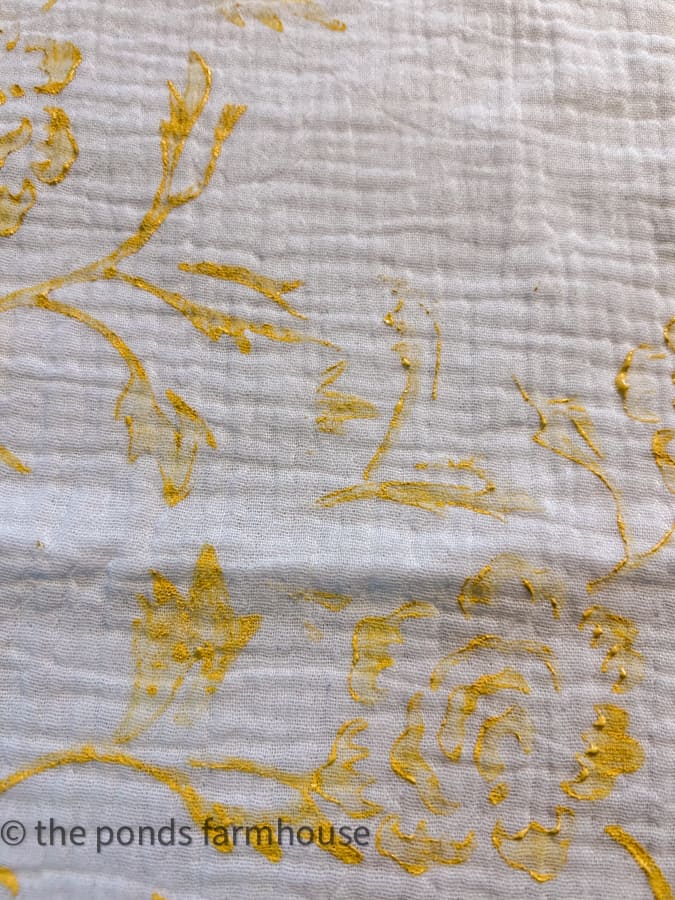 Close up of the unique yellow floral pattern on the DIY Napkins for a farmhouse style dinner party