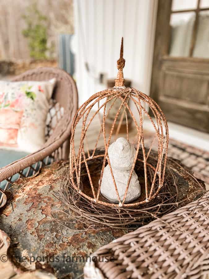 Garden Metal Cloche with a concrete bird great ideas to decorate for Easter on the porch.